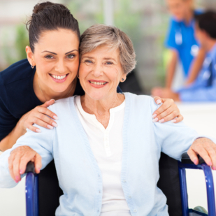 caring adult daughter accompanying senior mother visiting doctor